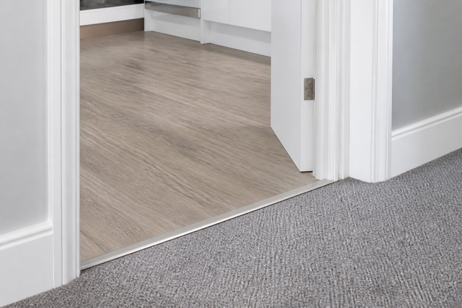 Neat transition between fitted carpet and vinyl
